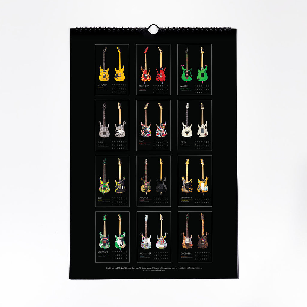 A spiral-bound wall calendar page featuring a grid of 12 electric guitars in various colors, displayed against a clean white background.